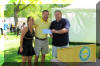 Mike and Cindy Huether accept the Love Serving Tennis Award from Tony Simons